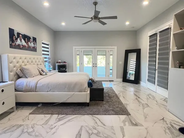 a bedroom with a bed and a couch