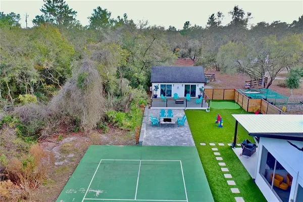 a view of a roof deck with wooden fence and floor