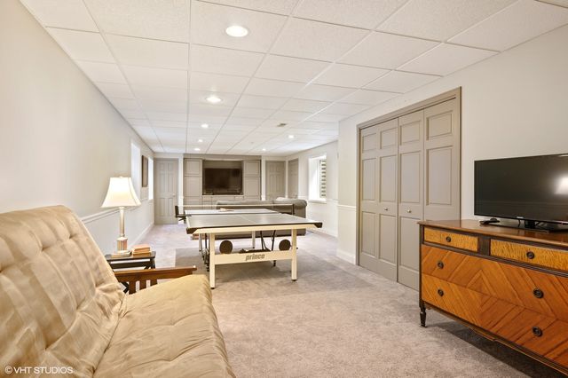 a living room with furniture and flat screen tv