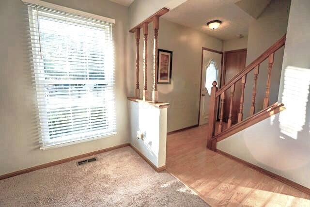 4572 Hidden Ridge Court Columbus, OH 43230 - Photo 9 of 43 Sunlit Entry Door, Closet, Stairway & Flooring.