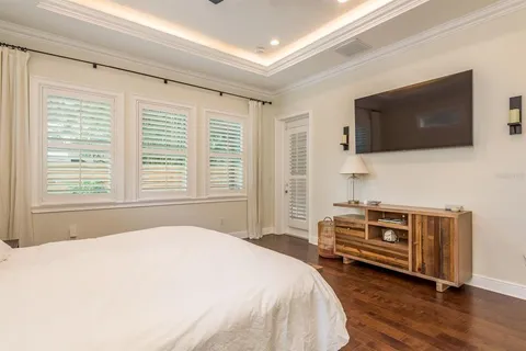 a bedroom with a bed and a table