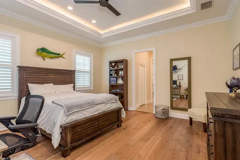 a bedroom with a bed and flat screen tv