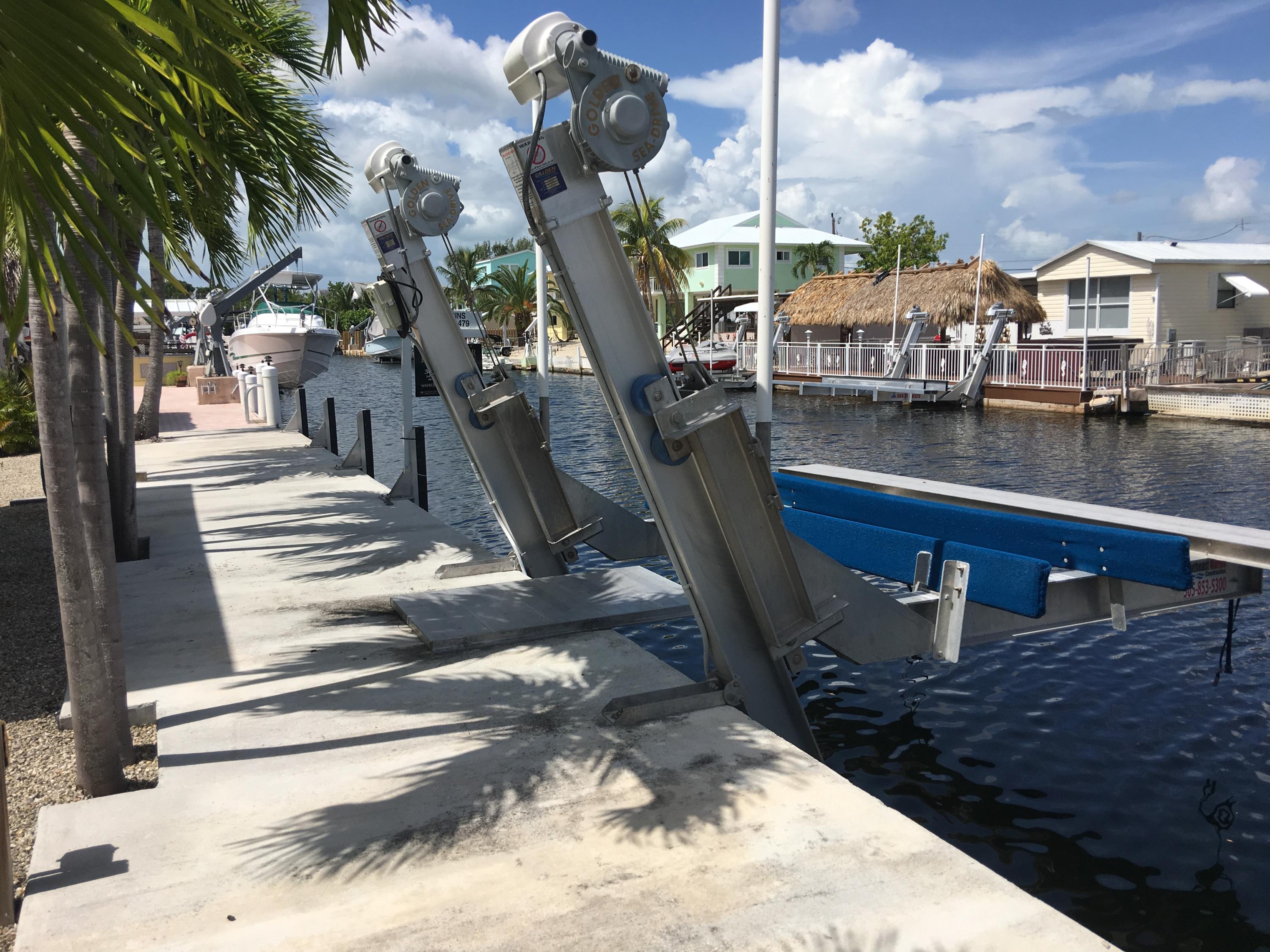 146 Long Key Road Key Largo, FL 33037 - Photo 3 of 18 Concrete dock and boat lift