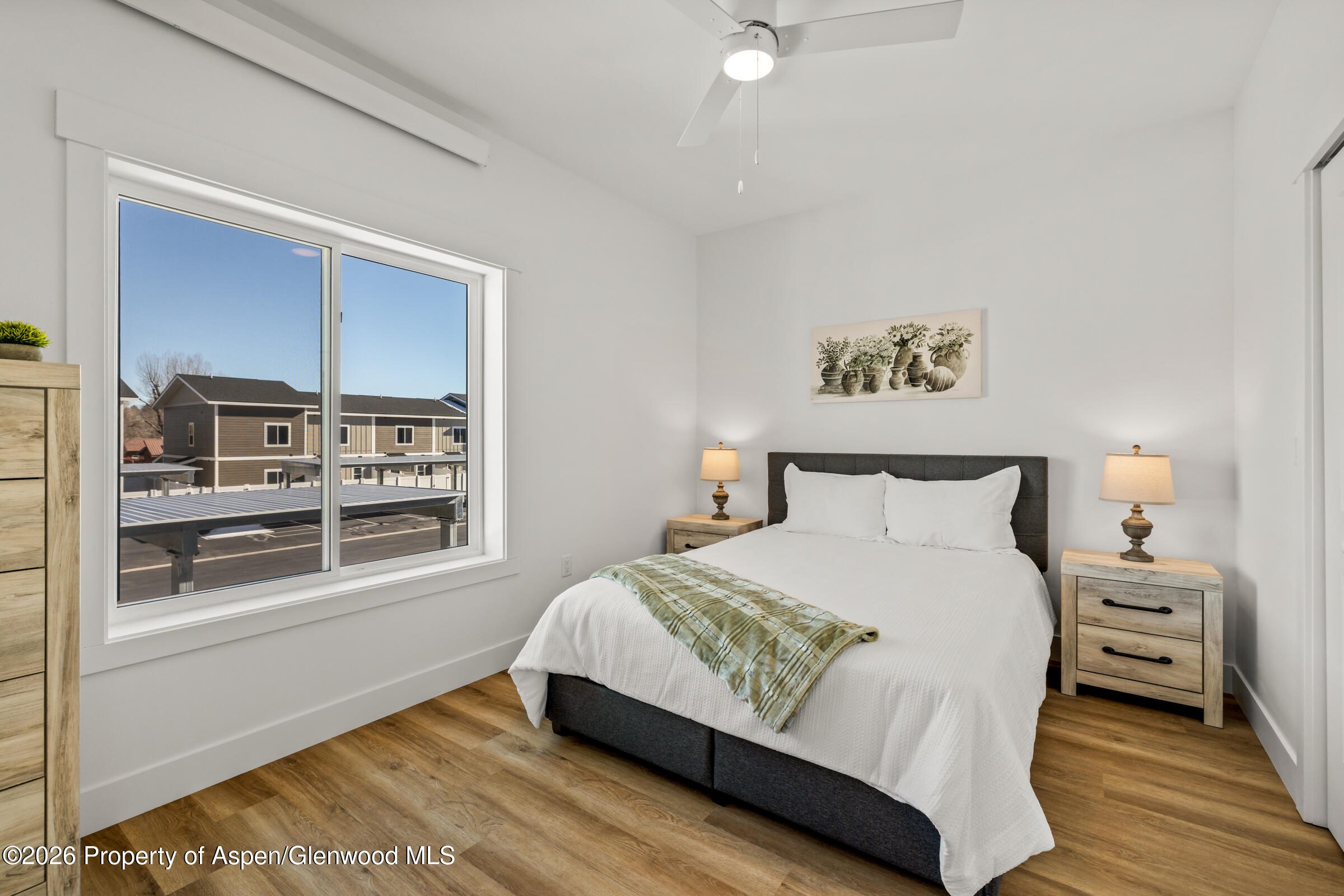 763 Russell Street Craig, CO 81625 - Photo 9 of 25 a bedroom with a bed and a window