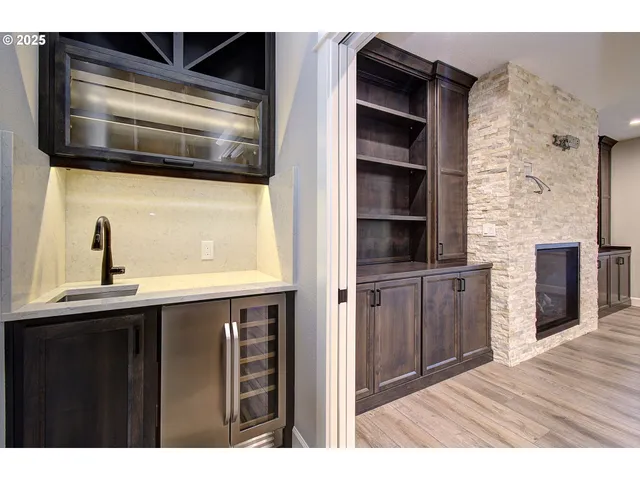 a kitchen view of a refrigerator and a sink