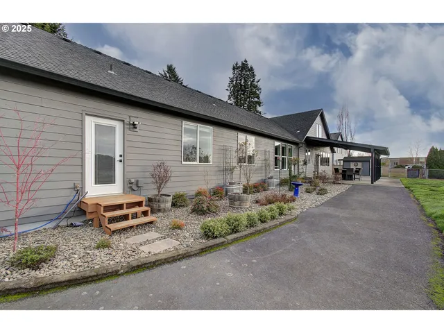 a front view of a house with garden