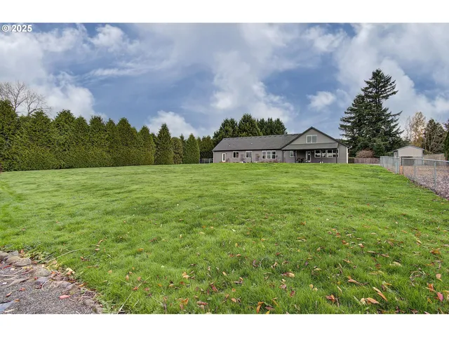 a view of a big yard with a house