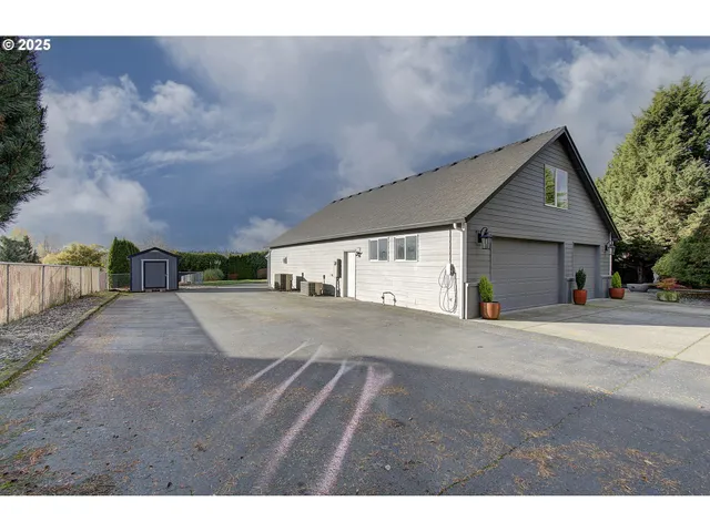 a view of a house with a yard and garage