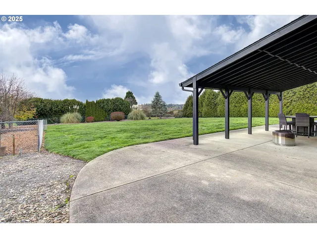 a view of a backyard with sitting area