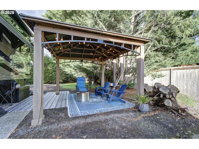 a aerial view of a house with a yard and lake view