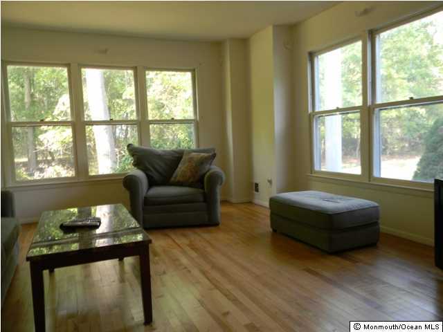 740 Harmony Road Jackson, NJ 08527 - Photo 2 of 3 a living room with furniture and a window