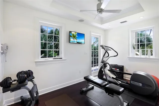 a room with gym equipment and windows