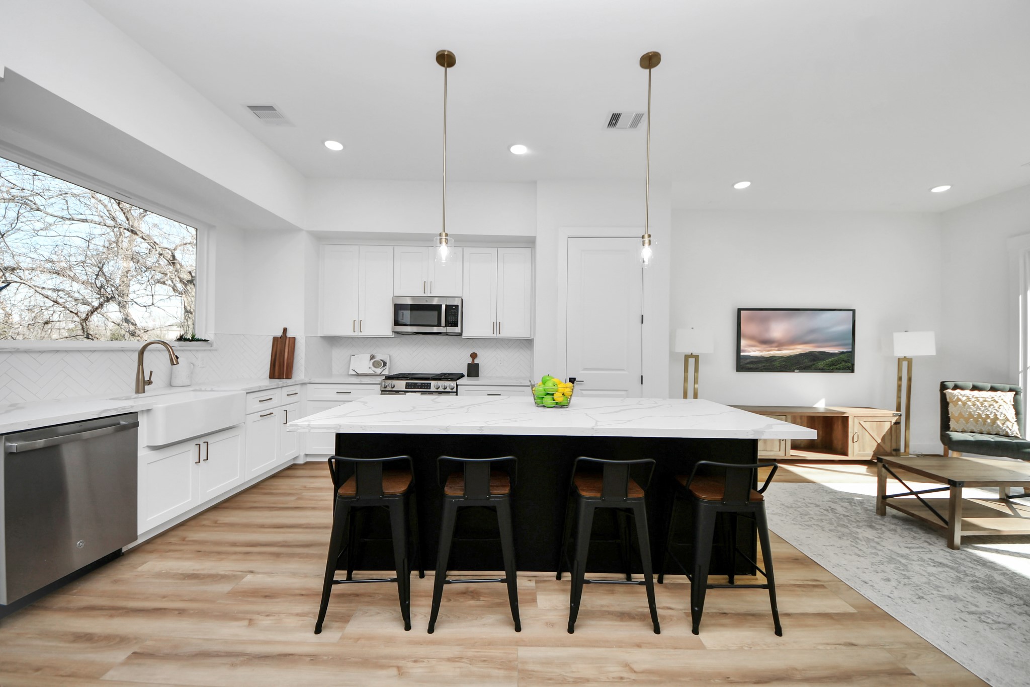 4804 Elysian Street, Unit B Houston, TX 77009 - Photo 14 of 49 a room with stainless steel appliances kitchen island granite countertop a dining table chairs and sink