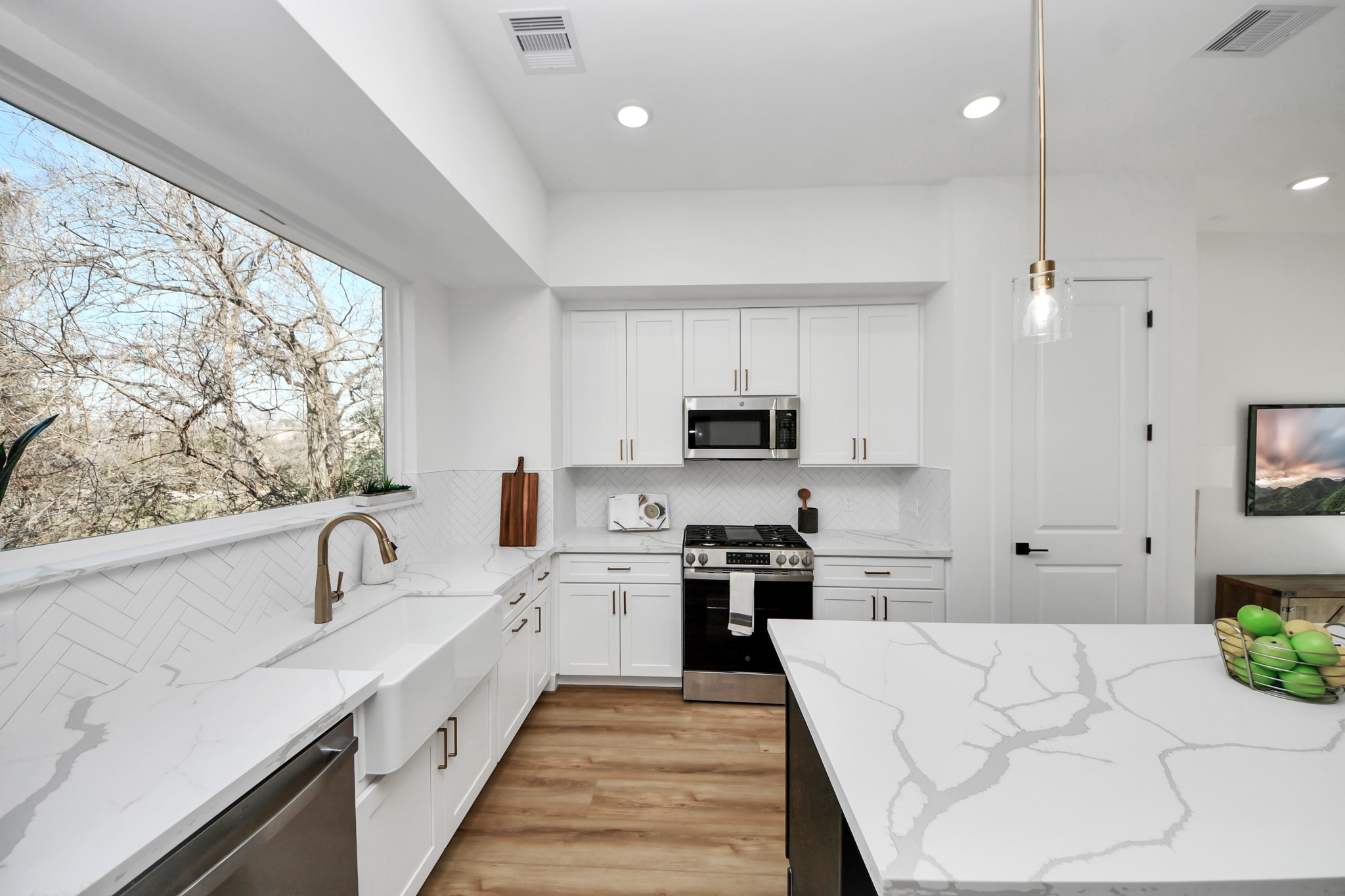 4804 Elysian Street, Unit B Houston, TX 77009 - Photo 15 of 49 a large kitchen with stainless steel appliances lots of counter space sink and cabinets