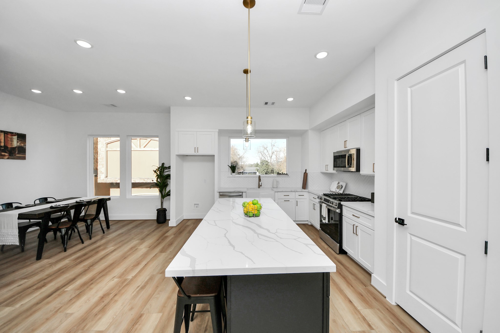 4804 Elysian Street, Unit B Houston, TX 77009 - Photo 19 of 49 a view of a dining room kitchen with furniture and wooden floor