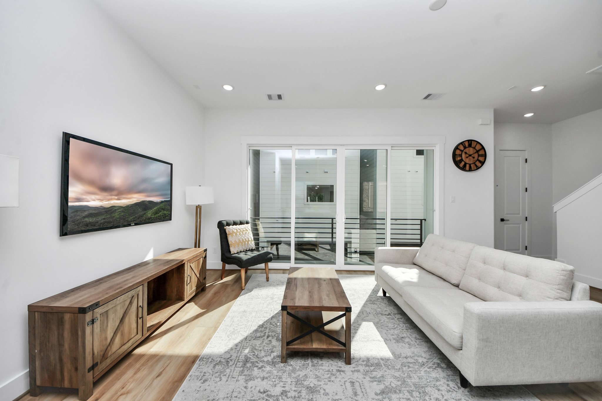 4804 Elysian Street, Unit B Houston, TX 77009 - Photo 22 of 49 a living room with furniture and a flat screen tv