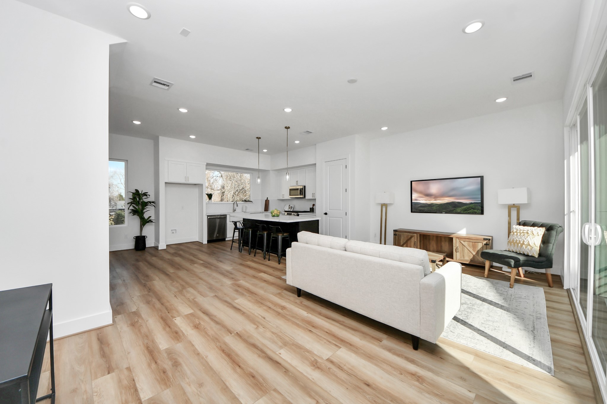 4804 Elysian Street, Unit B Houston, TX 77009 - Photo 26 of 49 a living room with furniture and a wooden floor
