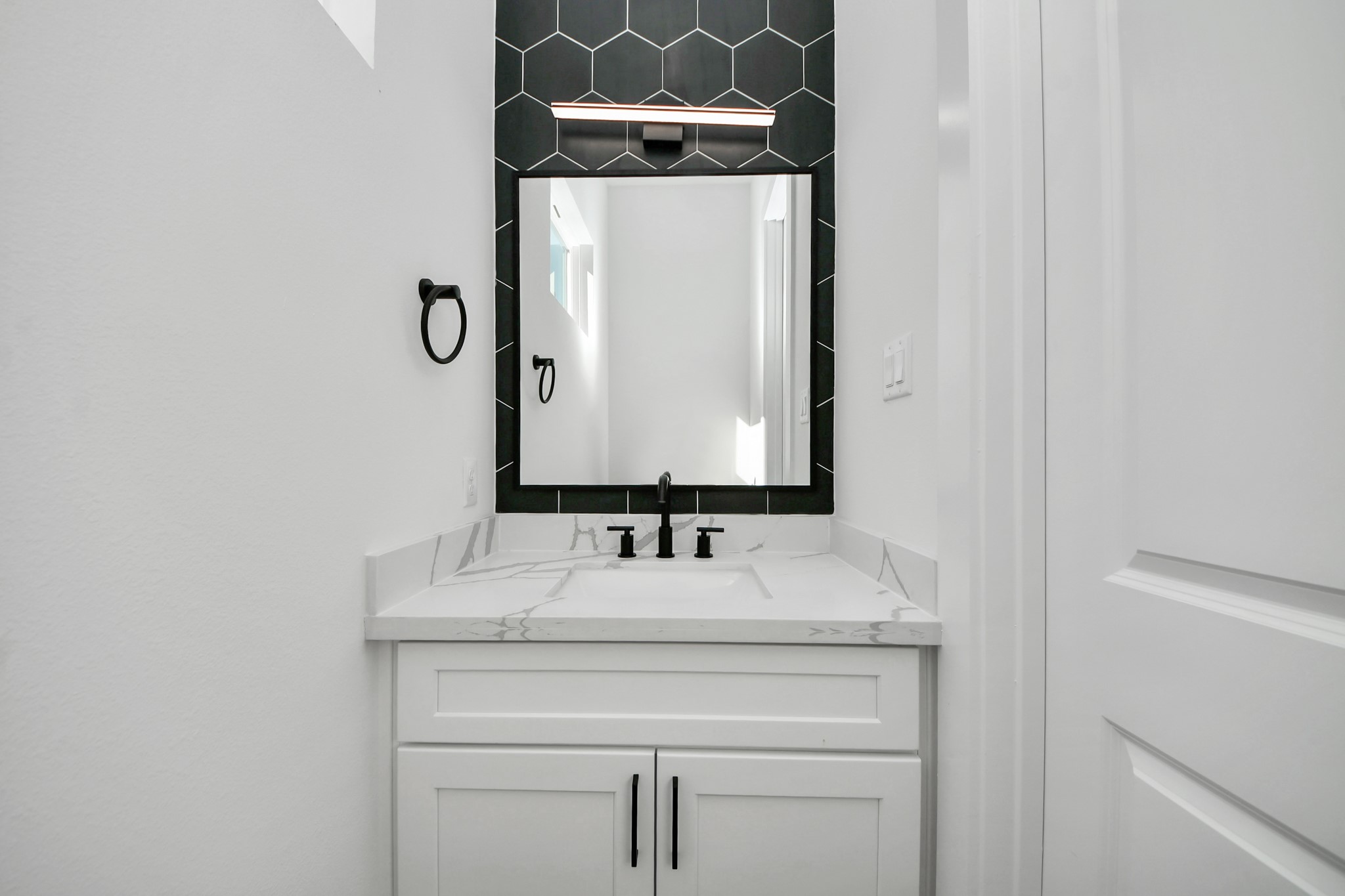 4804 Elysian Street, Unit B Houston, TX 77009 - Photo 27 of 49 a bathroom with a sink and a mirror
