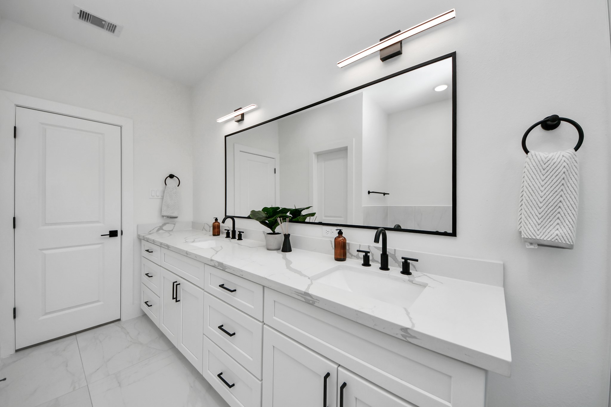4804 Elysian Street, Unit B Houston, TX 77009 - Photo 30 of 49 a bathroom with a double vanity sink mirror and double