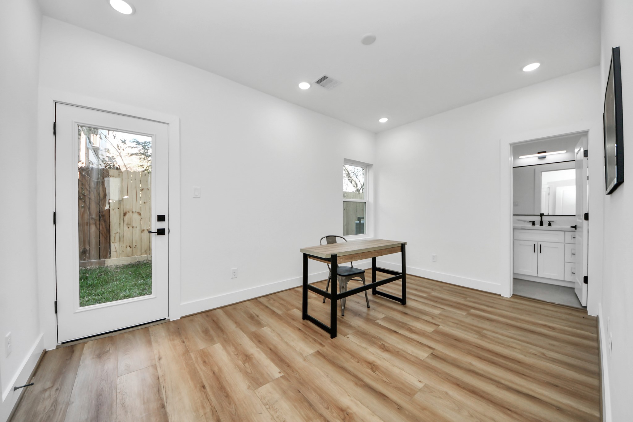 4804 Elysian Street, Unit B Houston, TX 77009 - Photo 5 of 49 a view of a room with wooden floor bathroom and windows