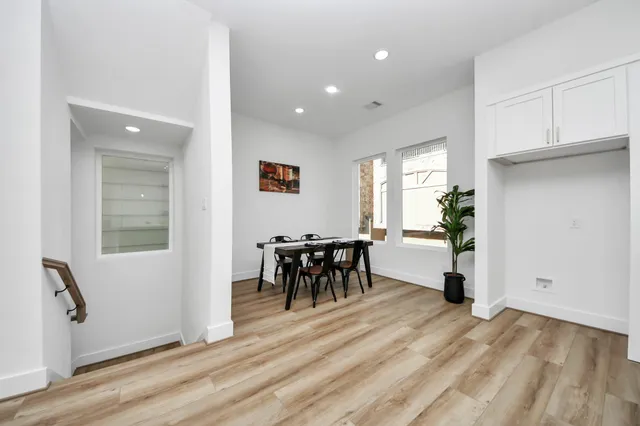 a view of a dining room with furniture and a window