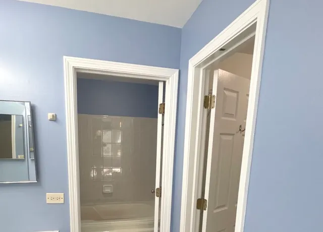 a view of a bathroom from a hallway