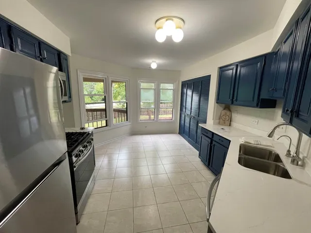 a kitchen with a refrigerator a sink and dishwasher