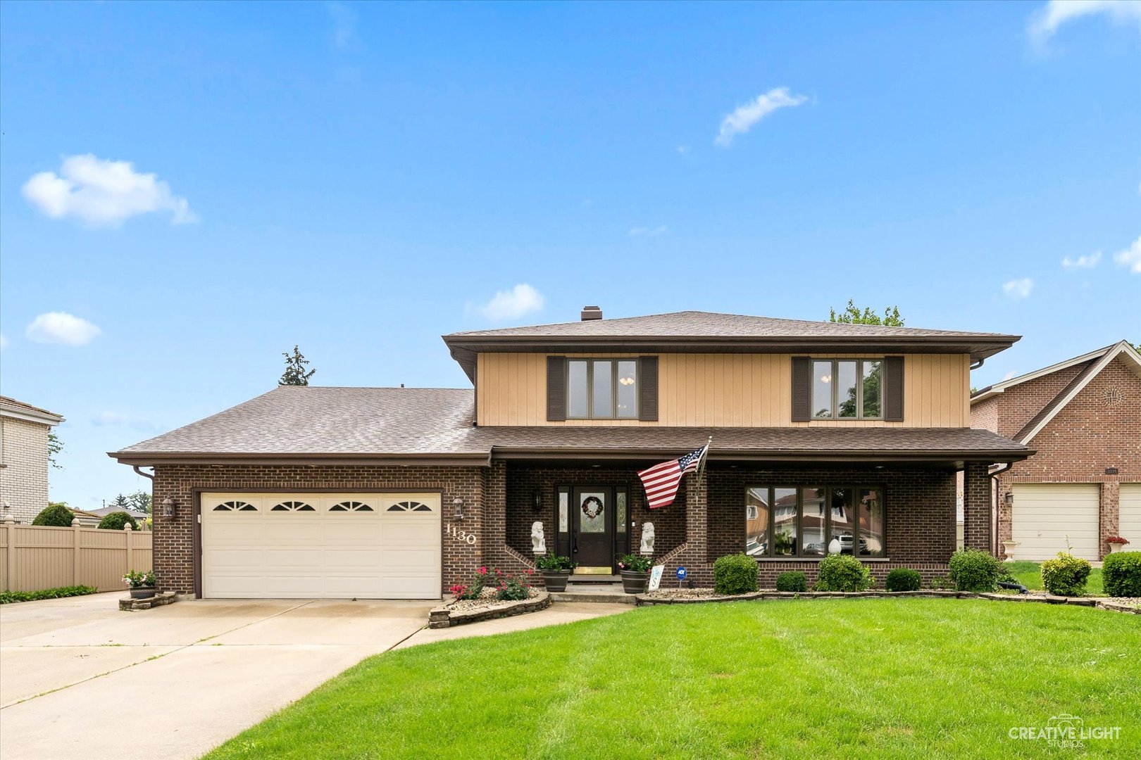 1130 Thatcher Lane Addison, IL 60101 - Photo 1 of 35 a front view of a house with a yard