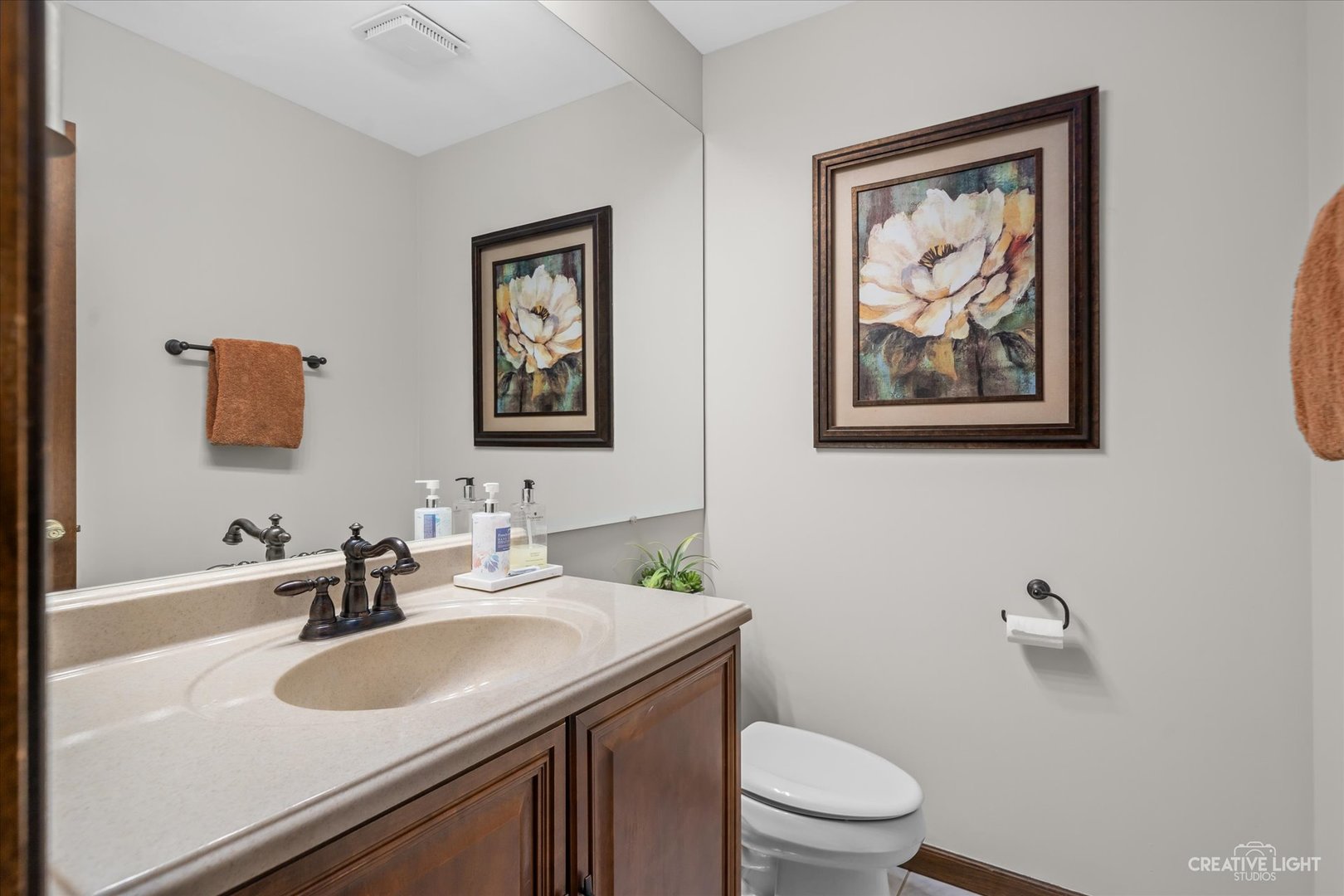 1130 Thatcher Lane Addison, IL 60101 - Photo 14 of 35 a bathroom with a toilet a sink and mirror