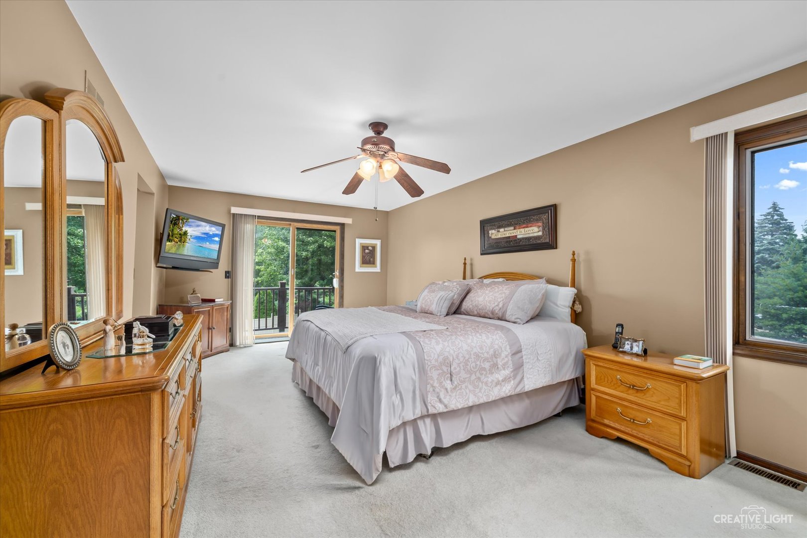 1130 Thatcher Lane Addison, IL 60101 - Photo 15 of 35 a spacious bedroom with a bed and glass windows