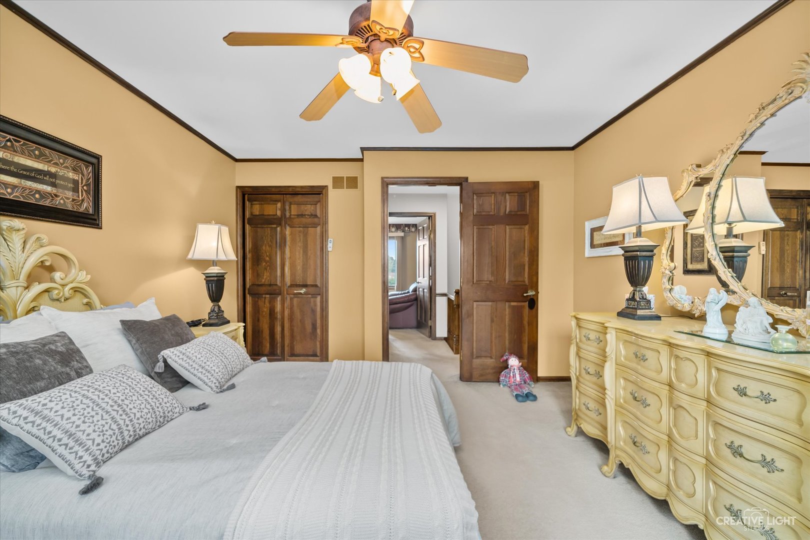 1130 Thatcher Lane Addison, IL 60101 - Photo 19 of 35 a bedroom with a bed and a chandelier