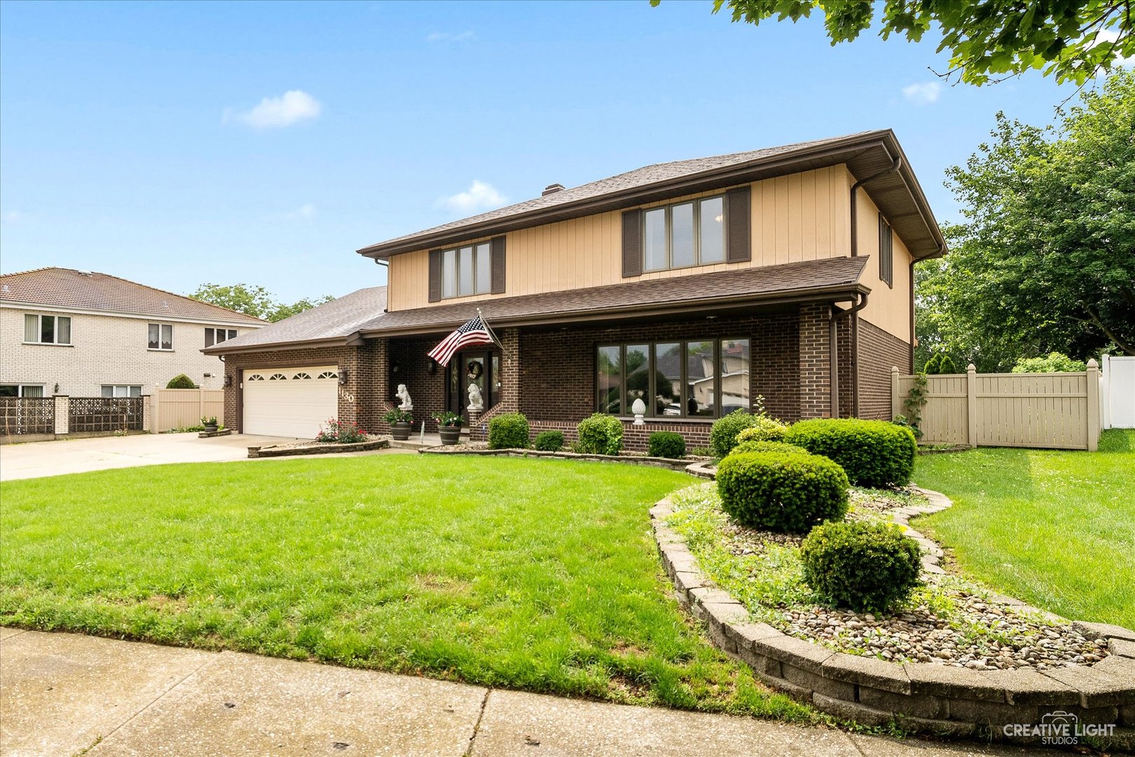 1130 Thatcher Lane Addison, IL 60101 - Photo 2 of 35 a front view of a house with porch yard outdoor seating and green space