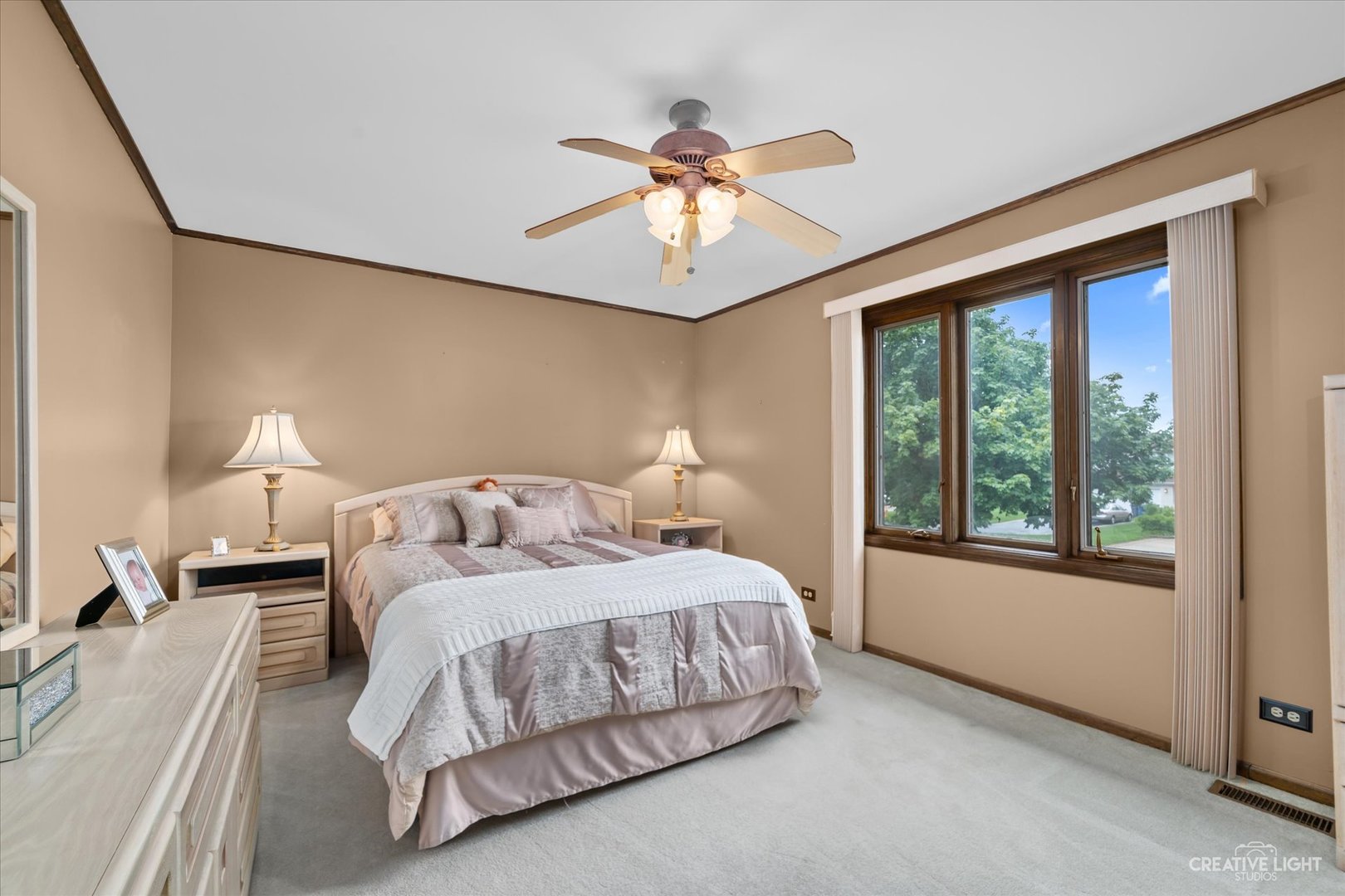 1130 Thatcher Lane Addison, IL 60101 - Photo 22 of 35 a bedroom with a bed and a chandelier