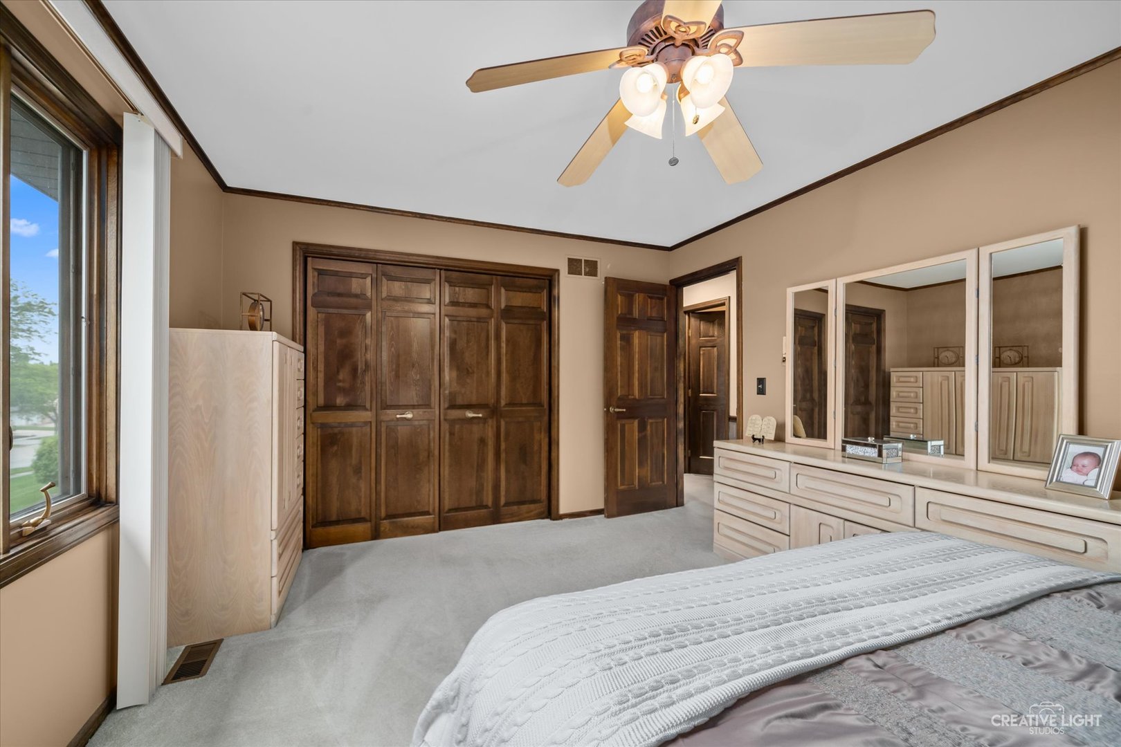 1130 Thatcher Lane Addison, IL 60101 - Photo 23 of 35 a bedroom with a bed closet and a large window