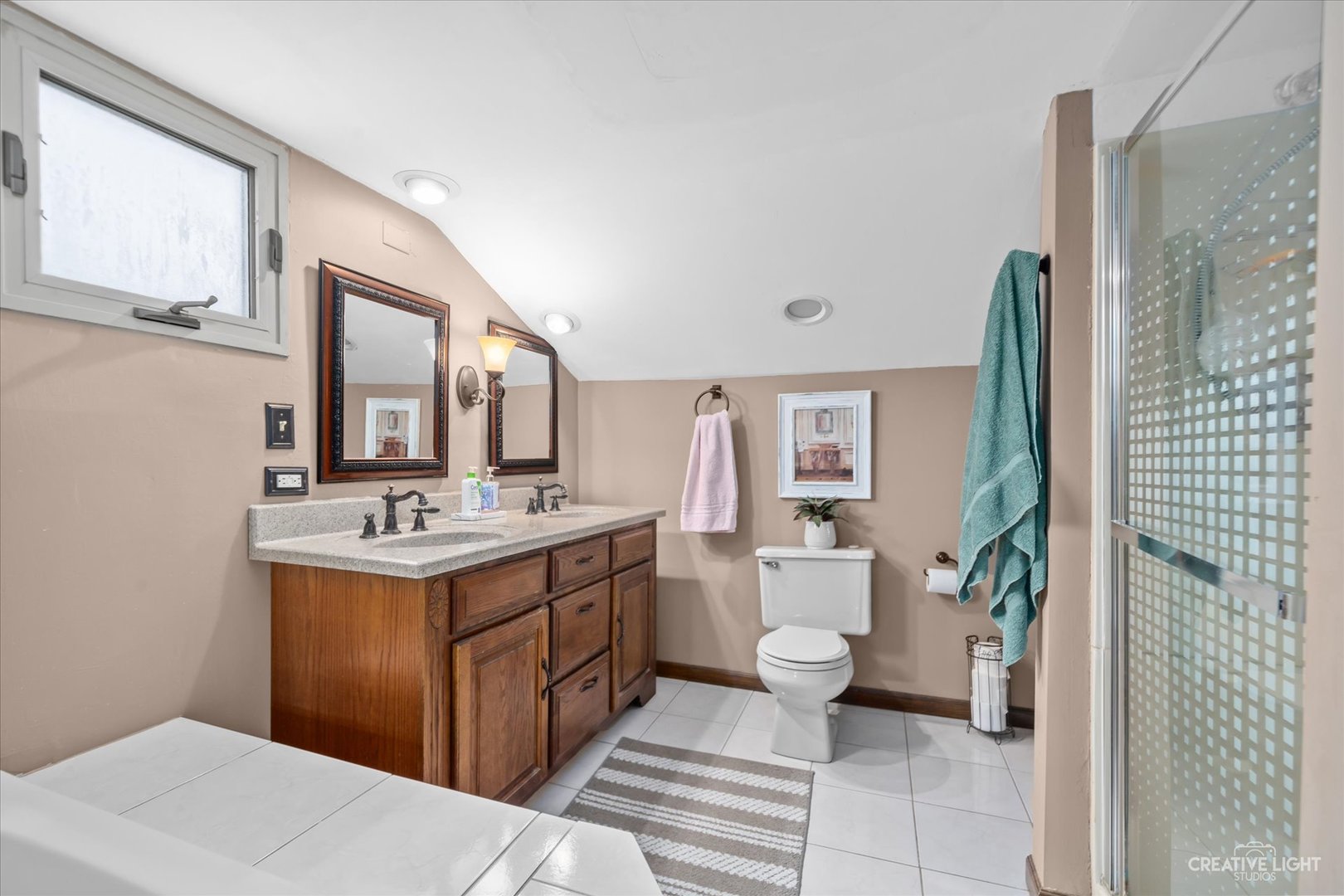 1130 Thatcher Lane Addison, IL 60101 - Photo 24 of 35 a bathroom with a sink a toilet and shower