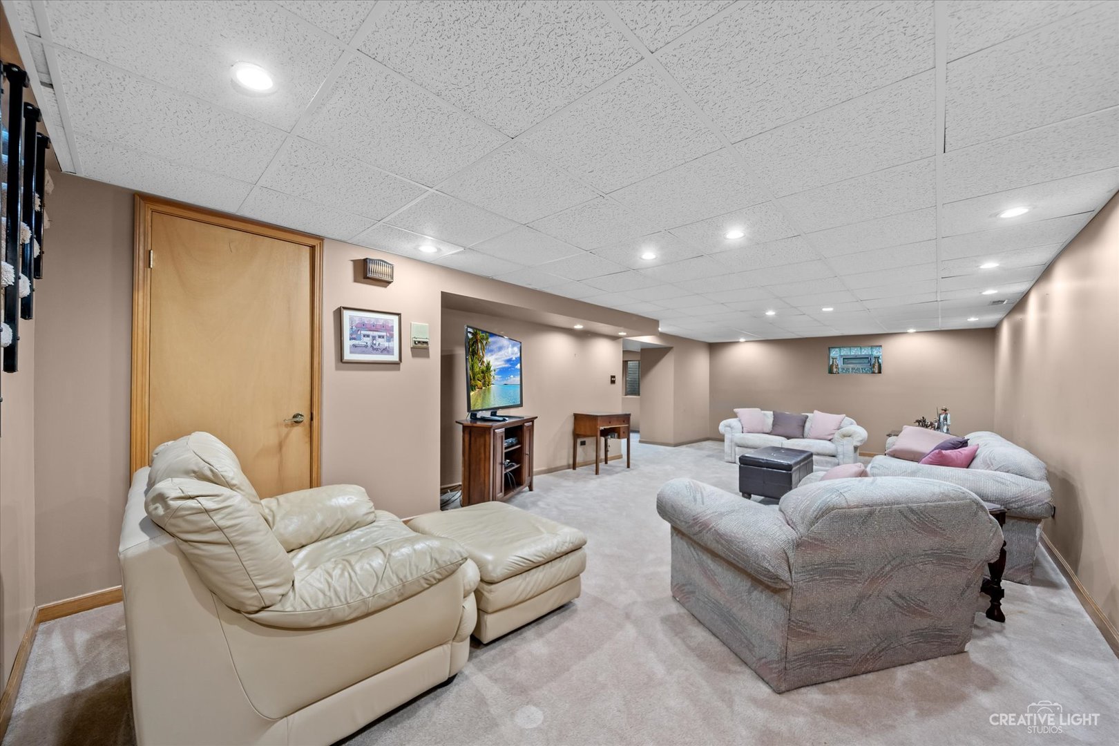 1130 Thatcher Lane Addison, IL 60101 - Photo 25 of 35 a living room with furniture and a couch