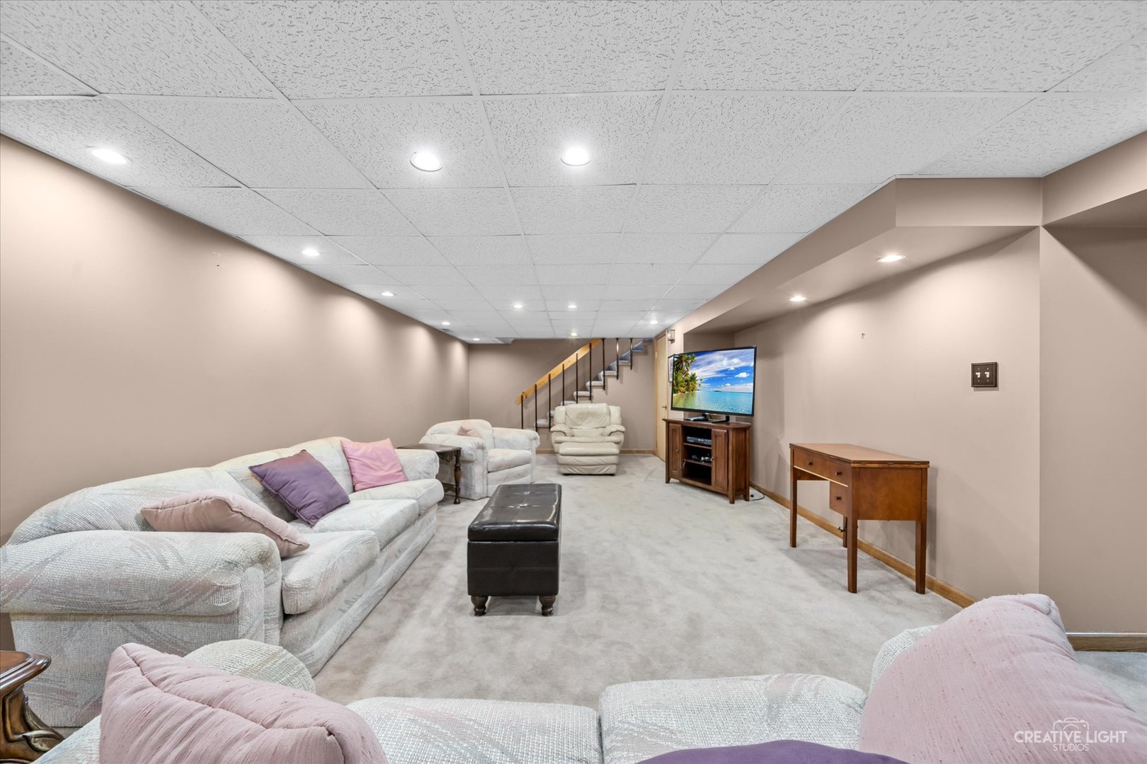 1130 Thatcher Lane Addison, IL 60101 - Photo 26 of 35 a living room with furniture and a couch