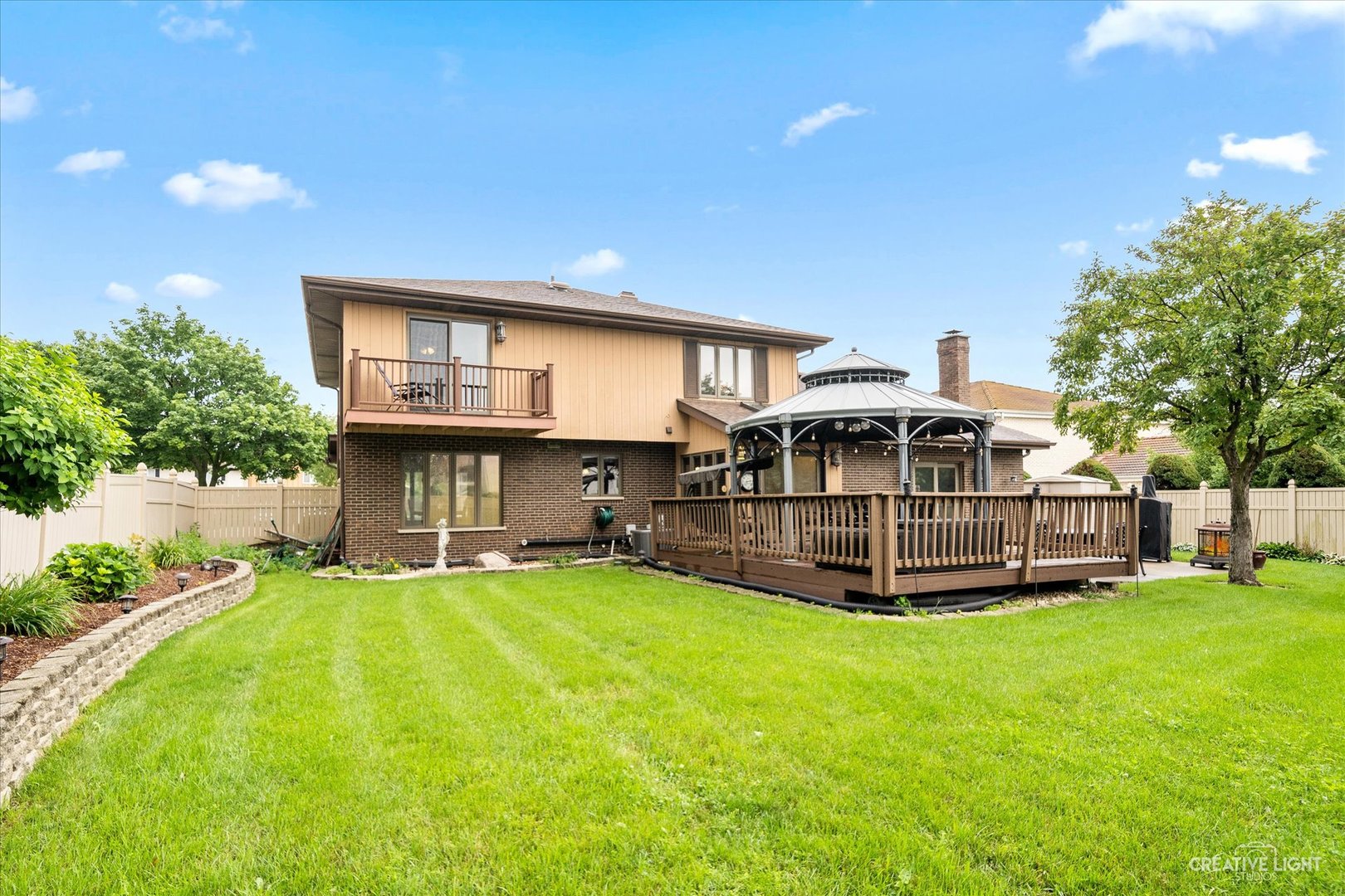 1130 Thatcher Lane Addison, IL 60101 - Photo 28 of 35 a view of a house with a yard and sitting area