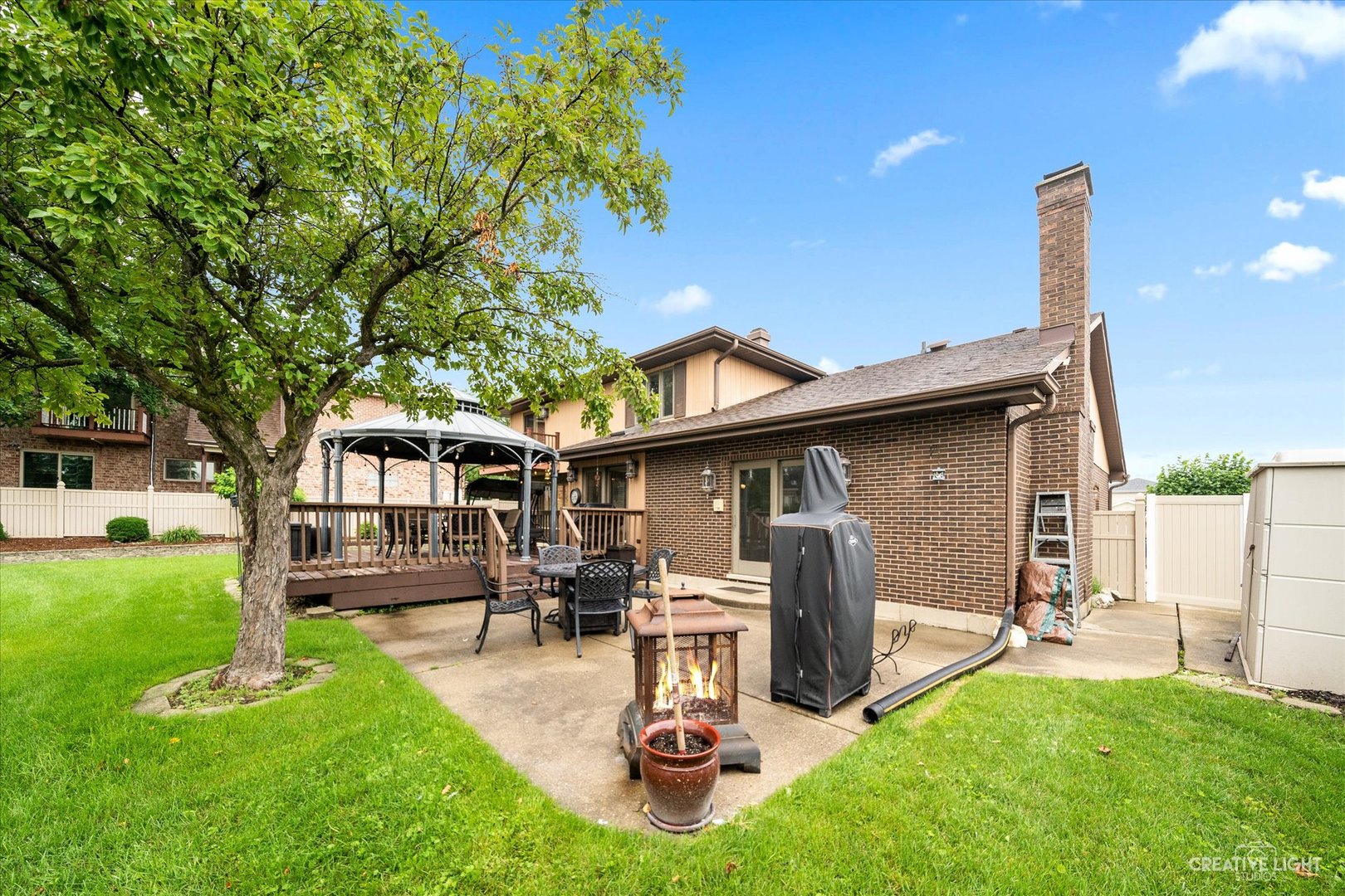 1130 Thatcher Lane Addison, IL 60101 - Photo 30 of 35 a front view of a house with garden and a tree