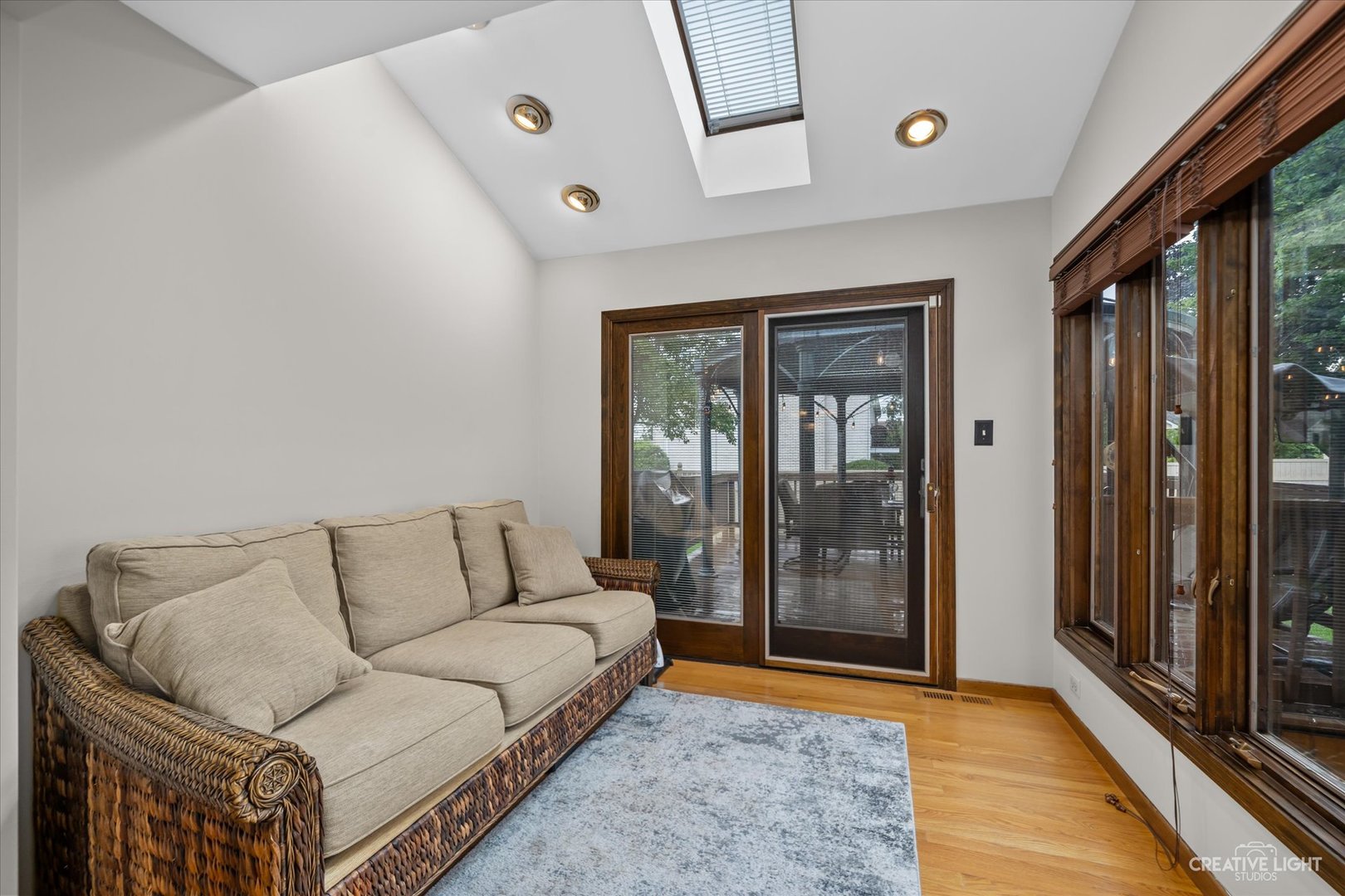 1130 Thatcher Lane Addison, IL 60101 - Photo 8 of 35 a living room with furniture and a rug