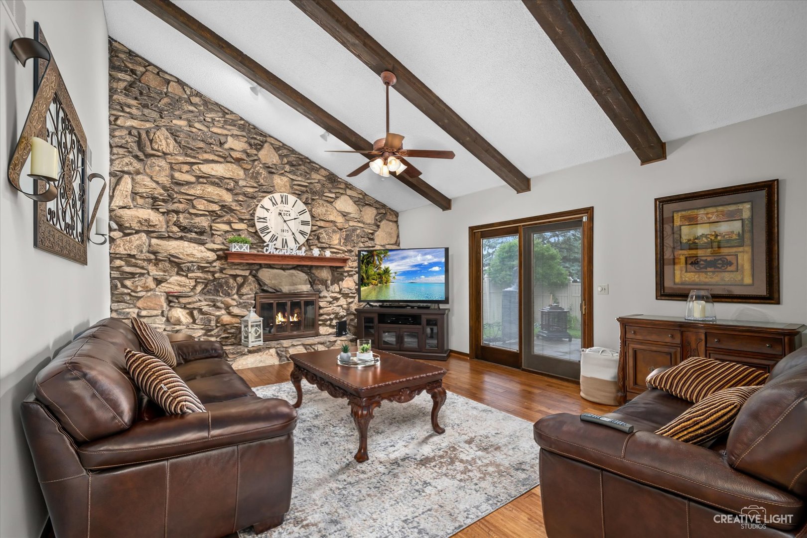 1130 Thatcher Lane Addison, IL 60101 - Photo 9 of 35 a living room with furniture and a fireplace