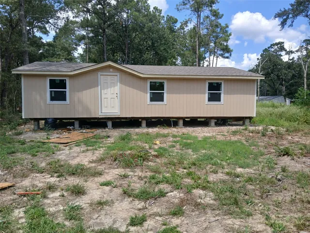 a view of a room with large windows