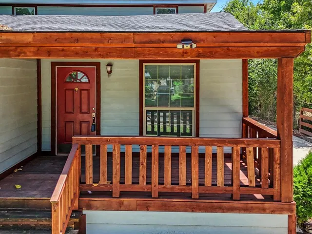 a view of a small house with wooden floor