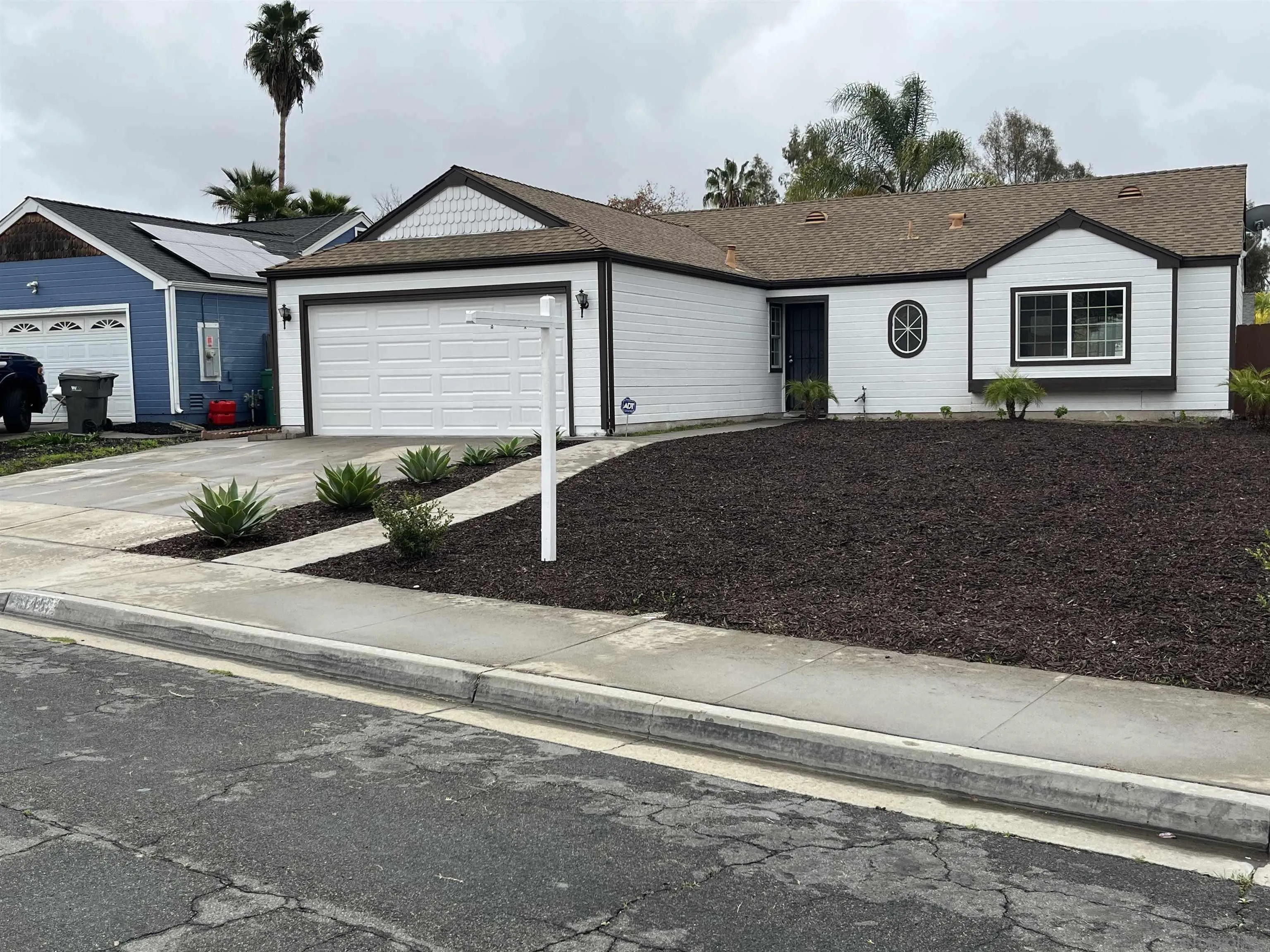 5145 Francis Street Oceanside, CA 92057 - Photo 1 of 21 a front view of a house with garden