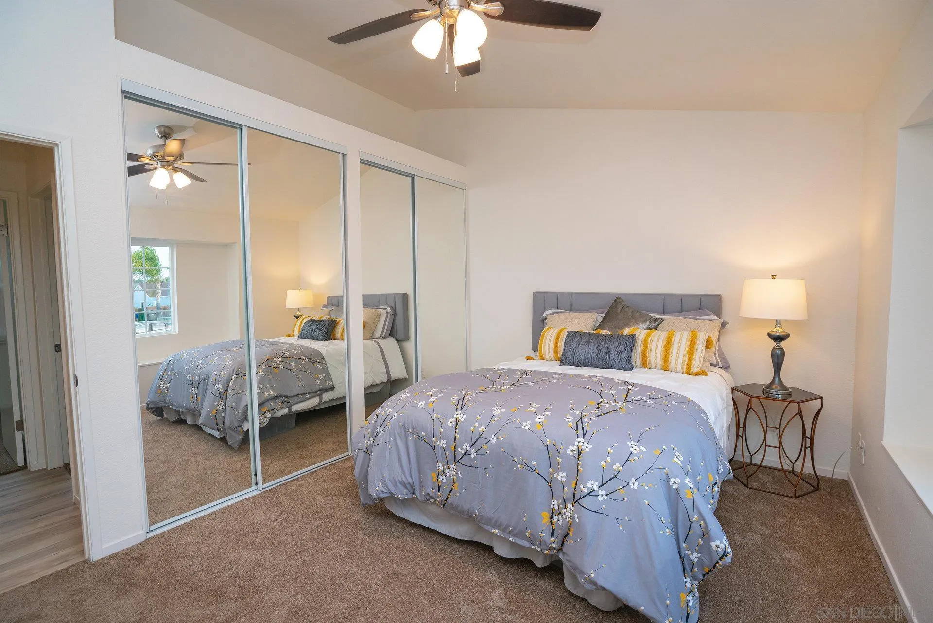 5145 Francis Street Oceanside, CA 92057 - Photo 12 of 21 a bedroom with a bed and a chandelier