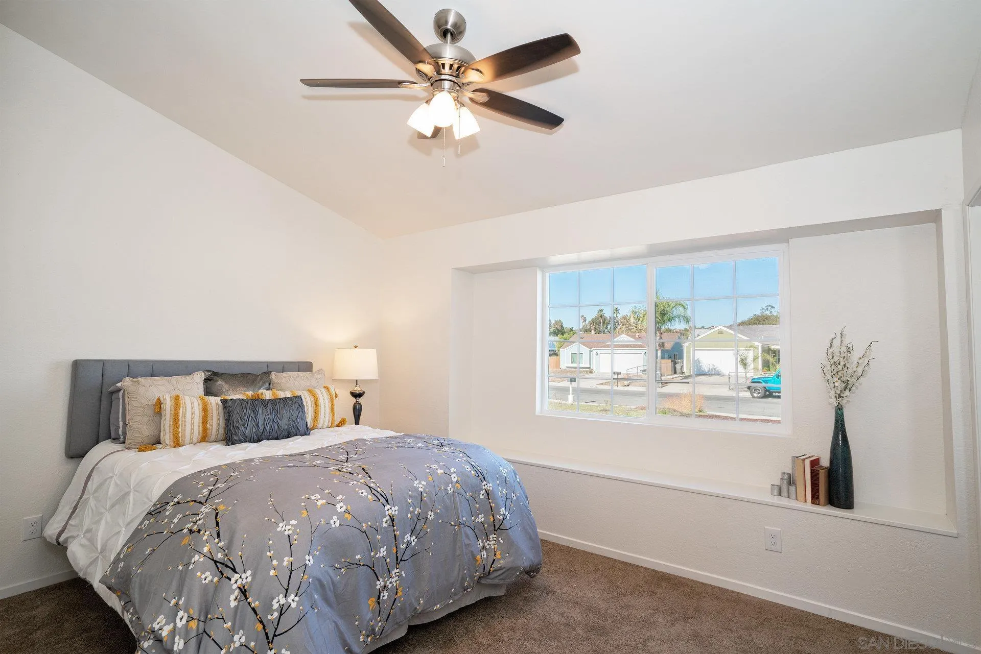 5145 Francis Street Oceanside, CA 92057 - Photo 13 of 21 a bedroom with a bed and a chandelier