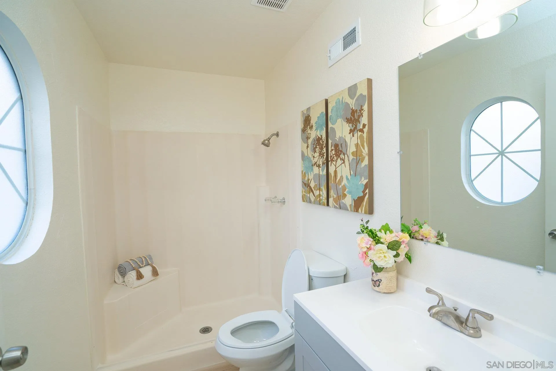 5145 Francis Street Oceanside, CA 92057 - Photo 14 of 21 a white toilet sitting next to a bathroom sink