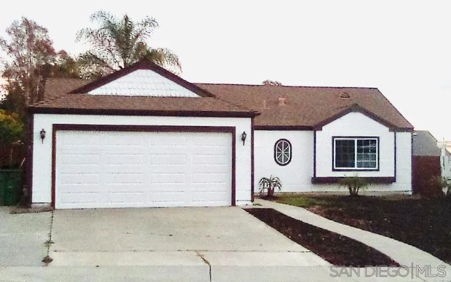 5145 Francis Street Oceanside, CA 92057 - Photo 2 of 21 a front view of a house with garden
