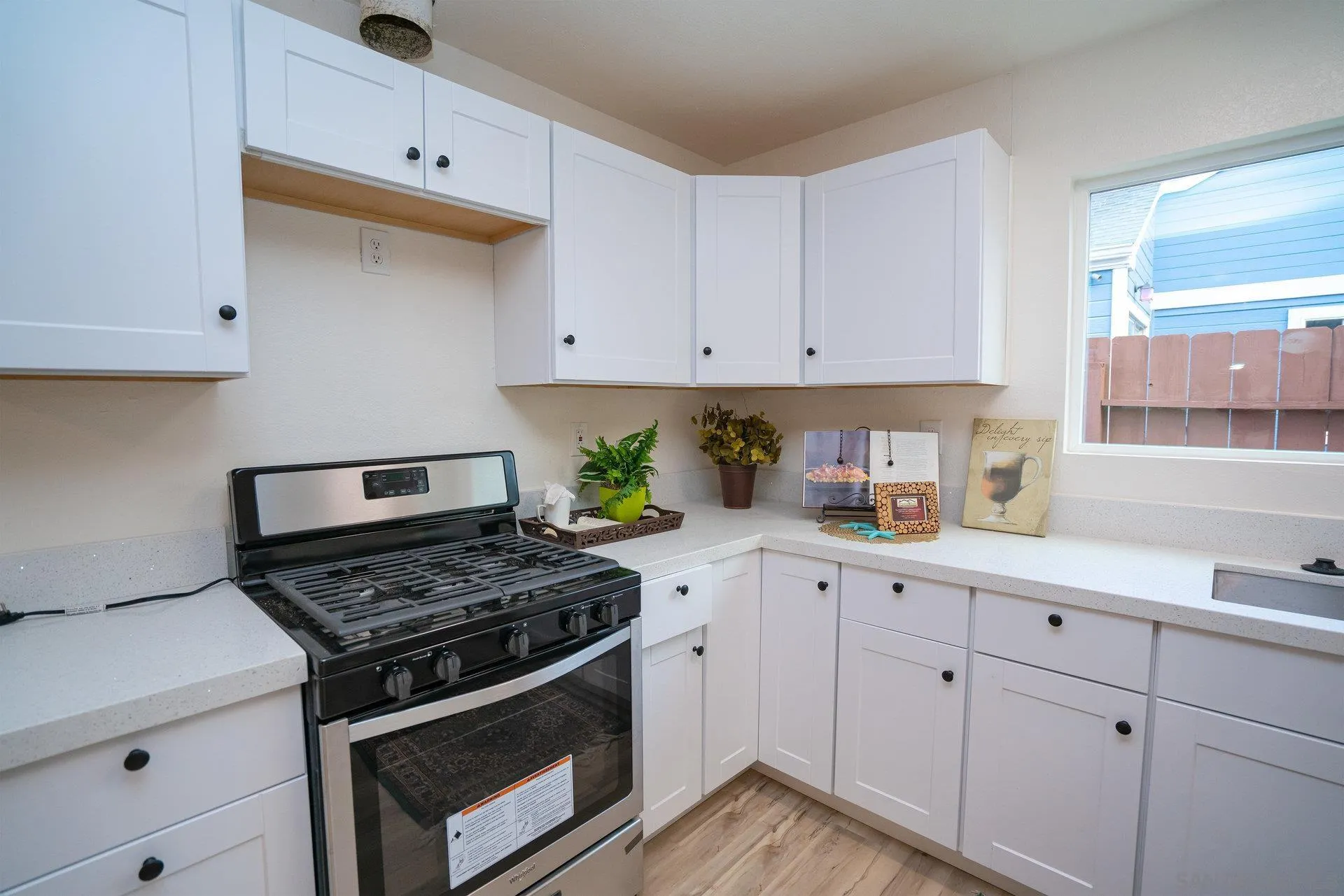 5145 Francis Street Oceanside, CA 92057 - Photo 3 of 21 a kitchen with white cabinets and appliances