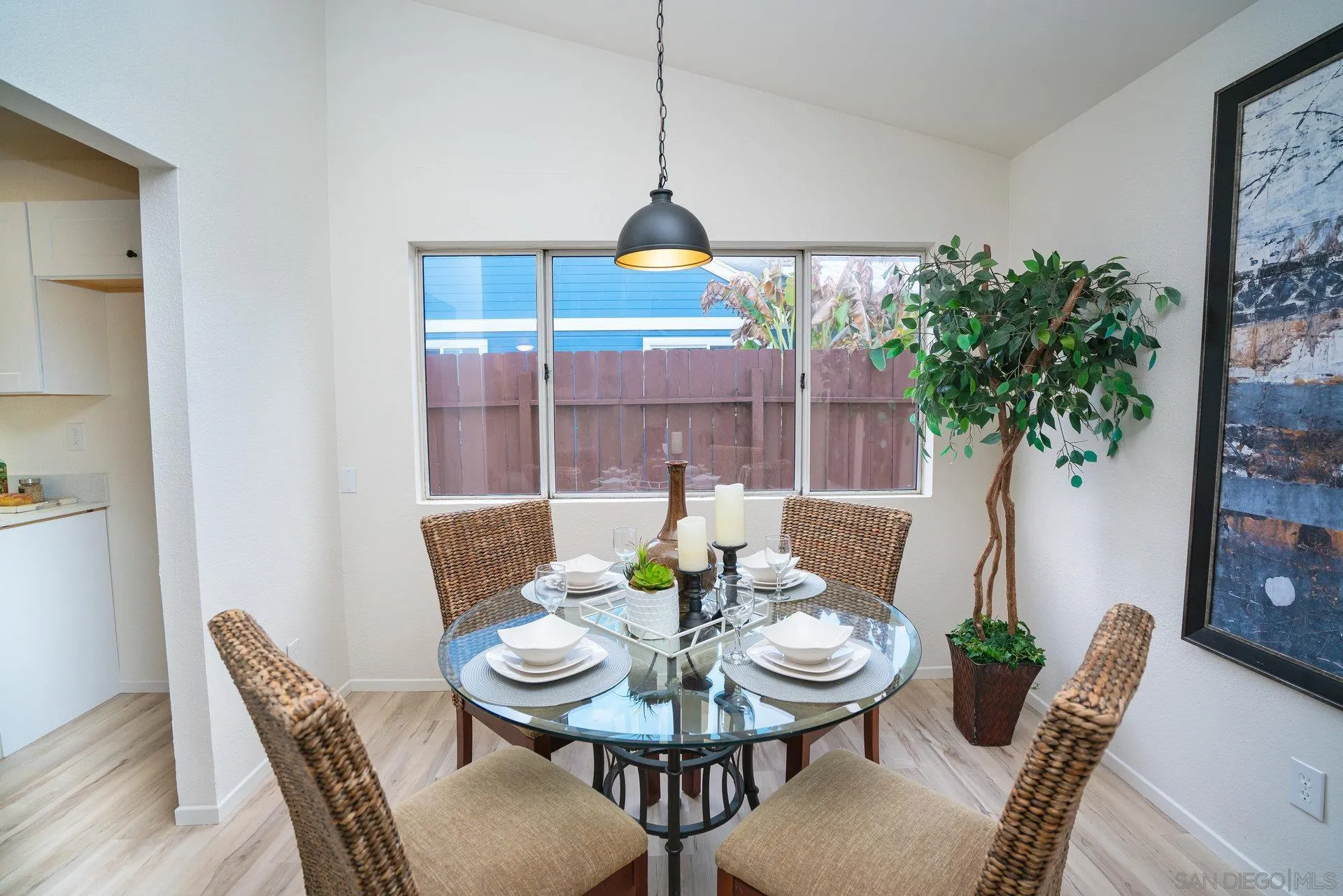 5145 Francis Street Oceanside, CA 92057 - Photo 5 of 21 a view of a dining room with furniture wooden floor and chandelier